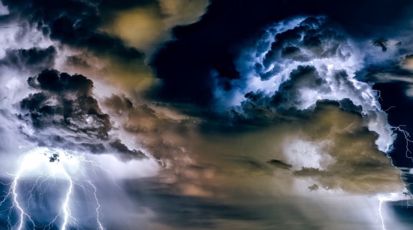Great, fierce cloud of white, gray, light blue and dark blue hues, with lightning.